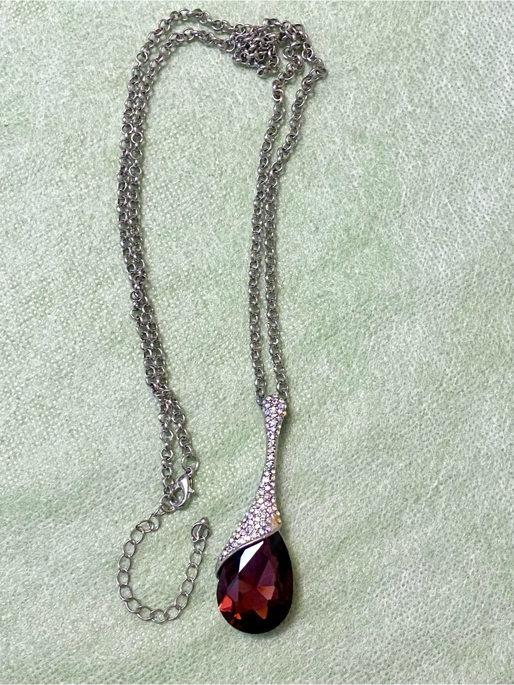 Elegant Silver Necklace with Deep Red Teardrop Pendant